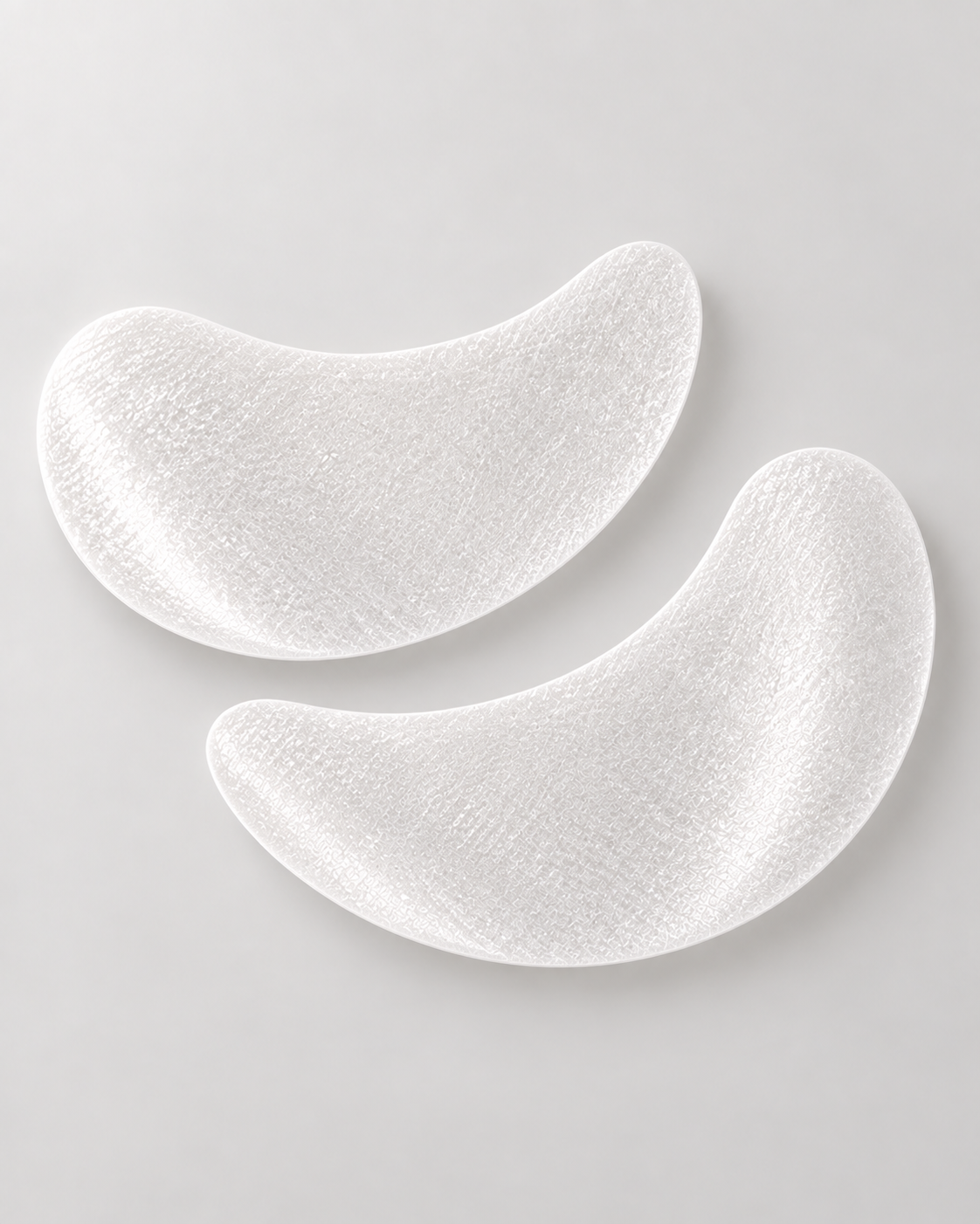 Zwei FRAUSCHMITZ Hydro Eye Pads aus hauchdünnem SecondSkin-Vlies – feine Textur in Nahaufnahme